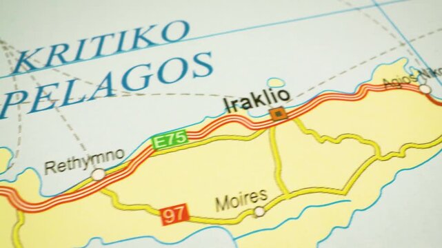 travel route across crete to heraklion &ndash; gliding view over atlas map