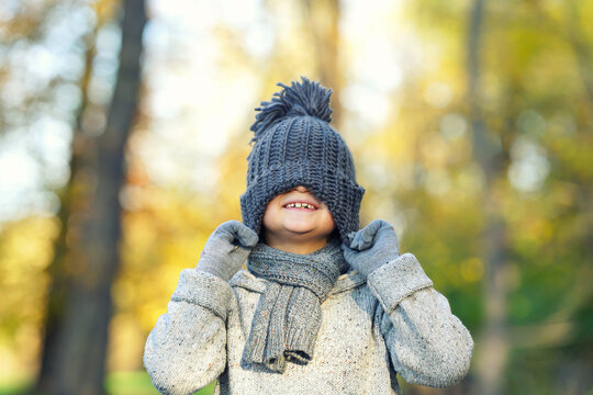 cute boy have a lot of fun in autumn season