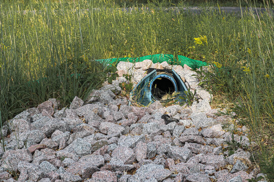Culvert Pipe and Silt Sock with Riprap Rock Erosion Control. Environment and Civil Engineering Concepts.