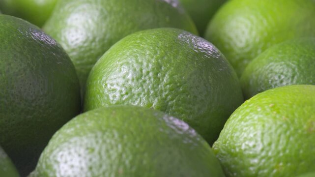 Closeup view of fresh ripe limes. Green juicy citruses