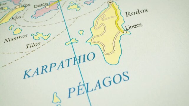 Sea route to rhodes island, greece &ndash; gliding view over atlas map