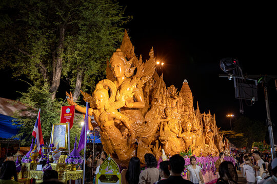 Buddhist Lent tradition, a beautiful display of wisdom, beeswax candles create art as a Buddhist offering.Background with Thai pattern carved on the surface of Lent candle.Ubon Ratchathani.Festival