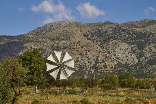 Windmill, canvas, field, mountains, blue sky, single white clouds, Lassithi plateau, Lassithi, East Crete, island of Crete, Greece
