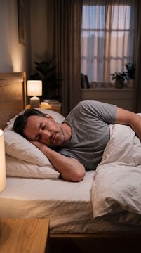 Man Falling into Deep Sleep in Modern Bedroom