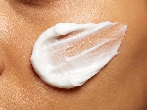 Macro View of White Cosmetic Cream Smear on Human Skin for Skincare Branding
