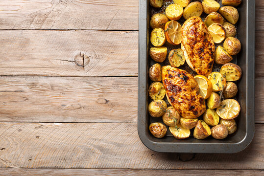 Oven roasted lemon garlic chicken and baby potatoes with herbs