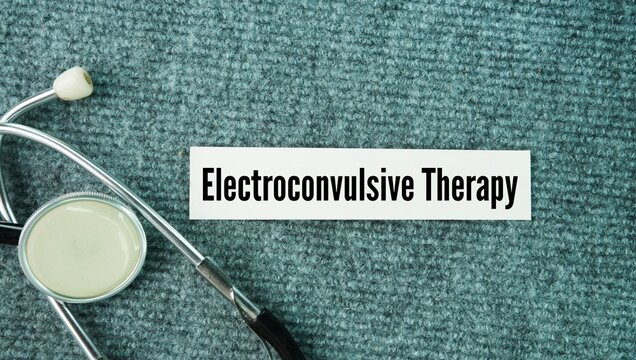 Stethoscope and paper with the word Electroconvulsive therapy ECT. medical procedure that uses small electric currents to trigger a brief, controlled seizure in the brain to treat severe mental health