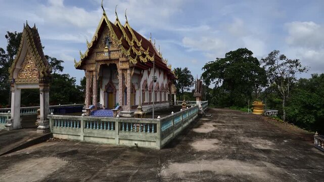 Exterior view of traditional Thai Theravada Buddhist temple pavilion at Wat Nong Khae in the southern province of Chumpon, Thailand