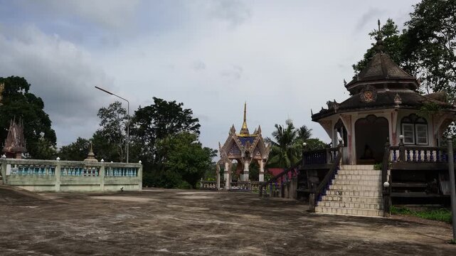Exterior view of traditional Thai Theravada Buddhist temple pavilion at Wat Nong Khae in the southern province of Chumpon, Thailand