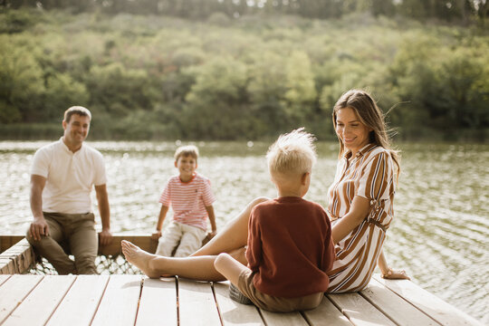 Enjoying a peaceful day by the lake with family on a warm afternoon