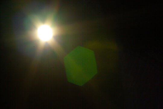 Sun flare on the black background