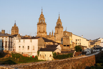 Obraz premium Historic Cityscape with Cathedral Towers and Roman Wall, Lugo, Spain