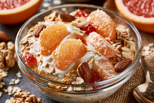Citrus yogurt oats and nuts breakfast on winter morning table