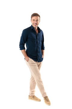Positive middle aged man standing with hands in pockets