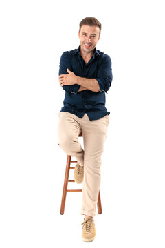 Positive man sitting on stool