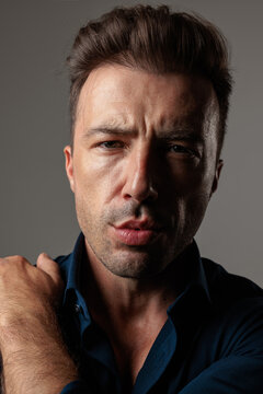Intense middle aged man touching shoulder