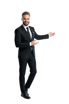 Elegant man presenting to the side and smiling
