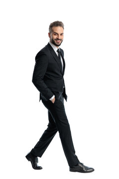 Side view of smiling man walking and looking forward