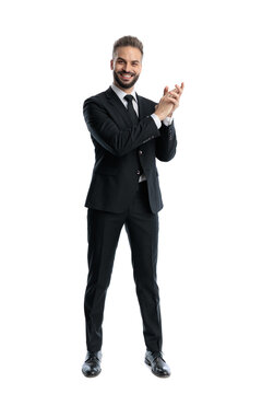 Handsome man clapping and looking forward