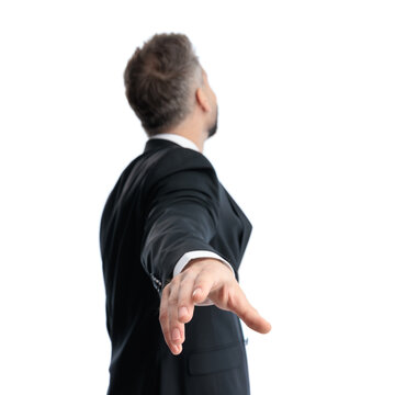 Back view of confident man extending hand backwards