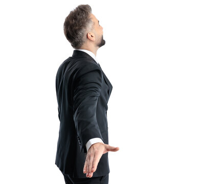Rear view of confident man with arms extended