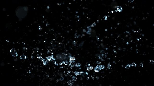 Super Slow Motion Shot of Water Drop Explosion Towards Camera at 1000fps. Cinematic Background.