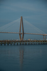 Fototapeta premium Arthur Ravenel Jr Bridge reflection over calm water