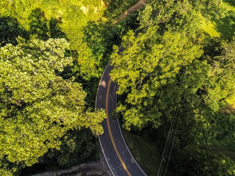 Aerial top down view of winding mountain road