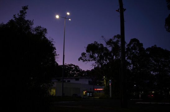 Red emergency sign illuminated at nightfall
