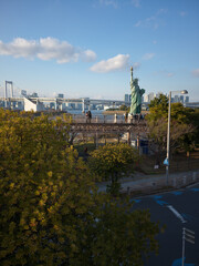 The Odaiba replica Statue of Liberty with the Rainbow Bridge behind, Japan © viabadalona