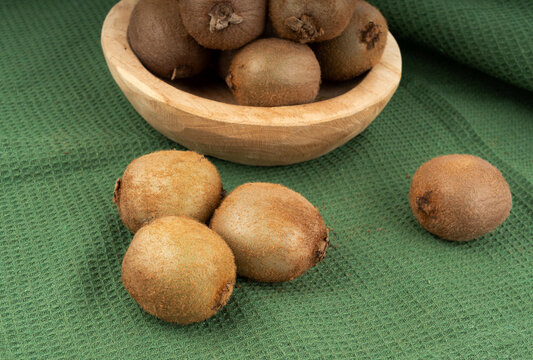 Kiwi fruits on table. Green kiwifruit pile