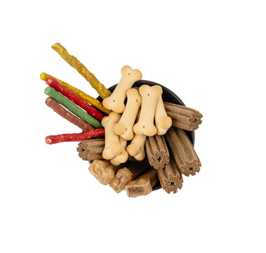Assorted dog kibble, many canine food, different color dry pet food mix, various dog snack pile