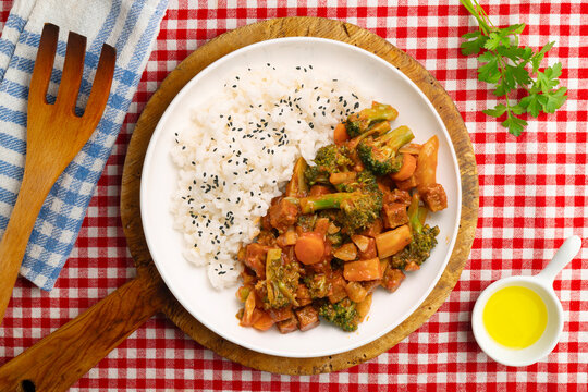 Vegetable and crispy tofu stew served with white rice. Top-down view. Traditional Christmas recipe.