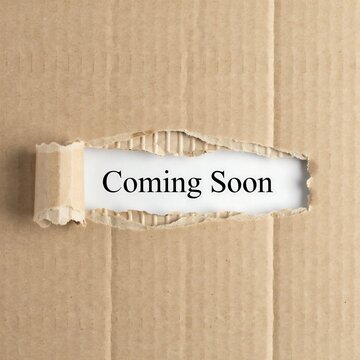 Coming soon text on torn brown cardboard paper background for business announcement and future marketing launch event 2027
