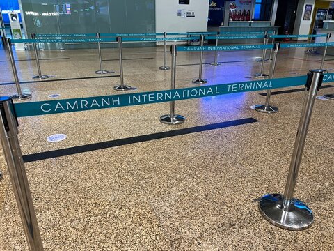 Cam Ranh Airport, Nha Trang, Vietnam, September 11, 2026: Blue barrier tape marked "Cam Ranh International Airport" in the baggage screening and flight check-in area