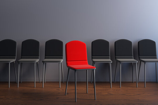 Red spotlight chair standing apart from a row of black seats in a modern interior, symbolizing career choice, hiring, and business opportunity. 3D Rendering