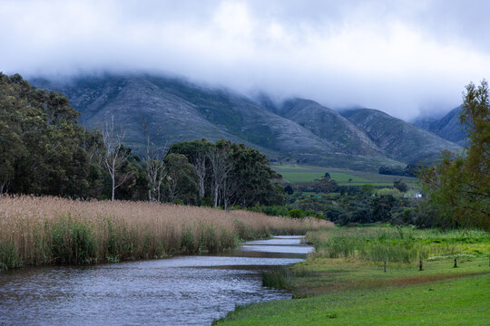 Klein River and Klein Mountains, Stanford, South Africa on a misty dark morning