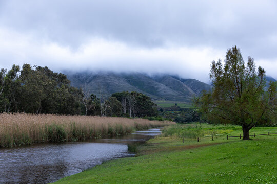 Klein River and Klein Mountains, Stanford, South Africa on a misty dark morning