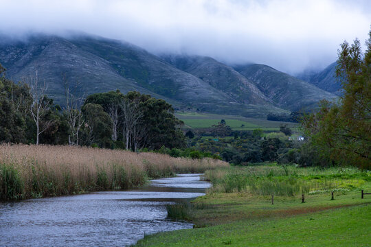 Klein River and Klein Mountains, Stanford, South Africa on a misty dark morning