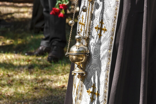 Orthodox Priest Holding Golden Censer
