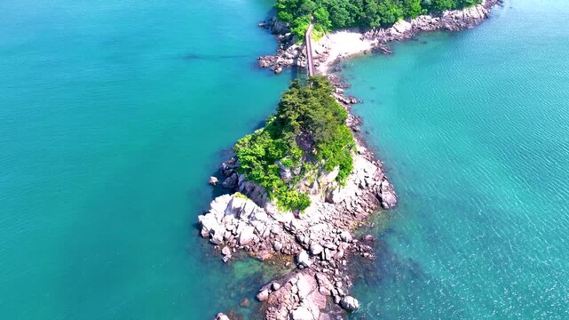 Cinematic 4K drone shot tracing a pedestrian bridge from Jawoldo to Mokseom Island, slowly transitioning into a top-down aerial view over the islet, South Korea.