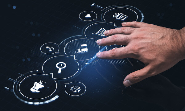 Business strategy concept with a hand navigating digital workflow icons for shopping, marketing, analytics and customer engagement on a dark interface.