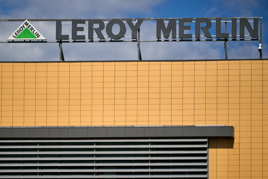 Corporate sign on the facade of a Leroy Merlin home improvement and hardware store against a cloudy sky in Gdansk, Poland