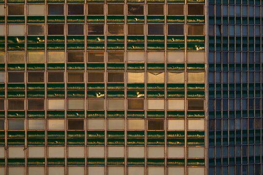 Abstract pattern of a modern skyscraper glass facade and window grid in Gdansk, Poland