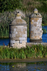 Historic stone fortification turrets standing in the water at Kamienna Sluza in Gdansk, Poland © sebastiangora