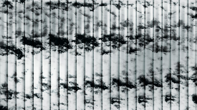 Black and white abstract pattern of vertical lines and geometric shapes