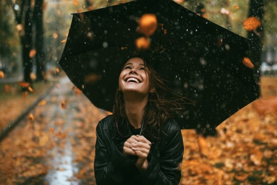 Rain falls softly around a laughing woman