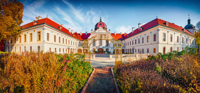 Panoramic morning view of Royal Palace of Godollo. Stunning autumn scene of Godollo - city in Pest County, Budapest metropolitan area, Hungary, Europe. Traveling concept background.