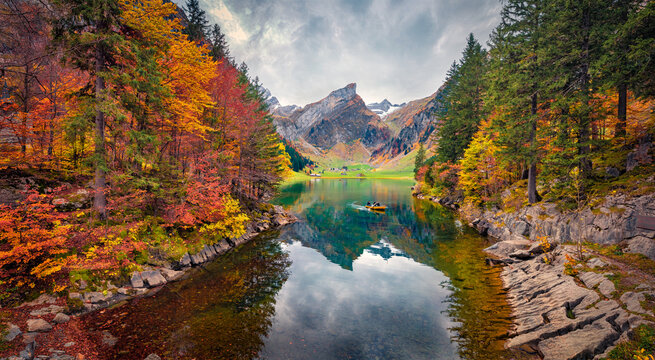 Calm morning scene of Seealpsee lake, Switzerland. Colorful autumn view of Swiss Alps. Stunning Santis peak reflected in the calm surface of pure water lake. Beauty of nature concept background.
