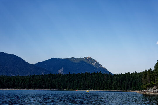 Turquoise Waters and Islands of Lake Eibsee Beneath Zugspitze Mountain Peak